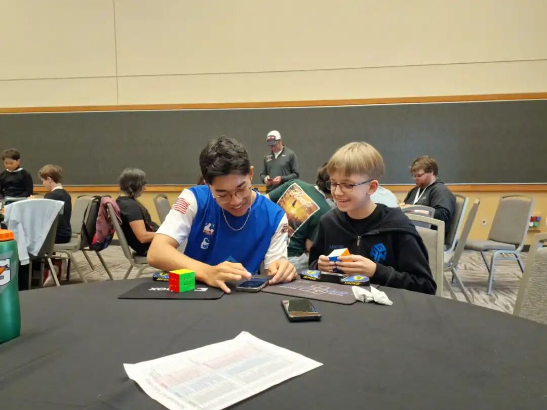 Timofei and Matty practicing together at a competition scene