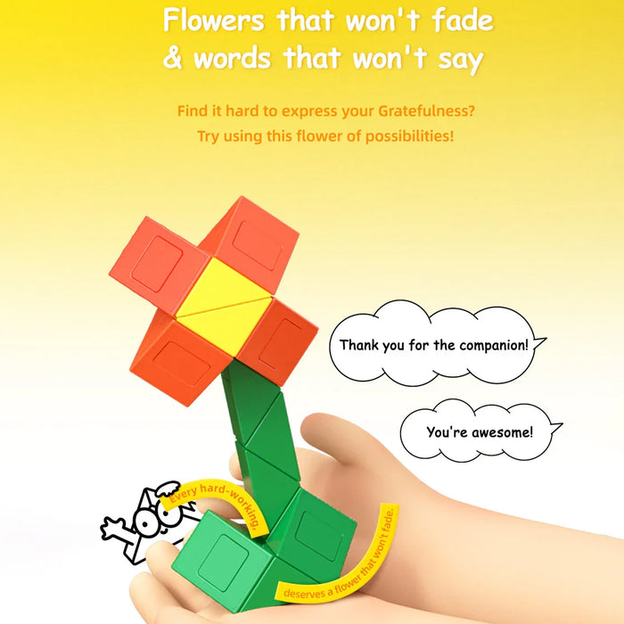 Hand holding a colorful twist puzzle shaped like a flower with orange petals, yellow center, and green stem against a yellow background