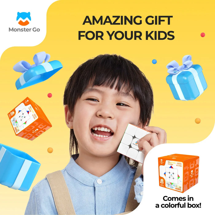 Happy child holding Monster Go magnetic 3x3 cube puzzle with colorful gift box on yellow background