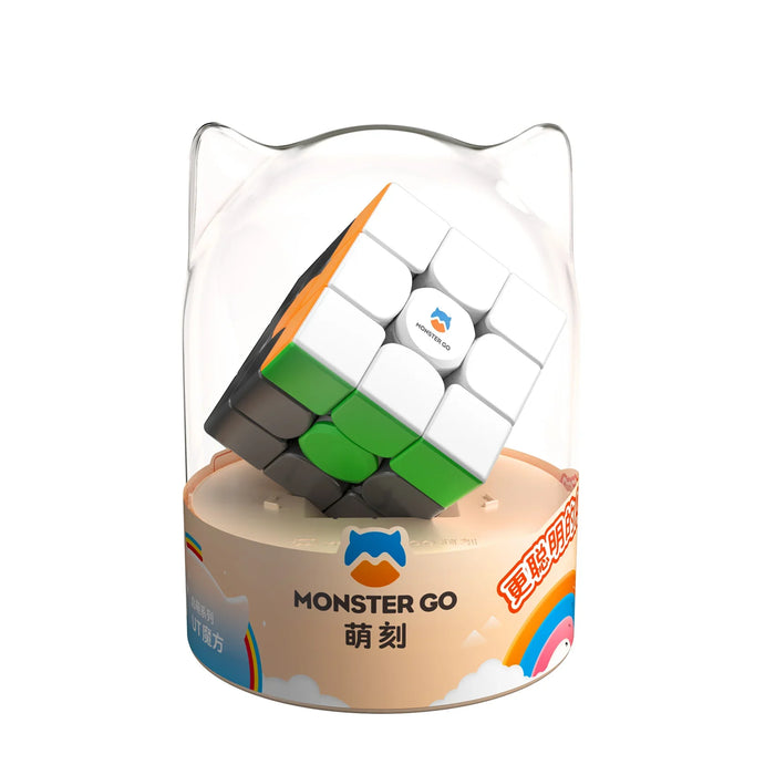 Monster Go 3x3 speed cube puzzle in protective cat-ear clear plastic case on beige rainbow-themed base